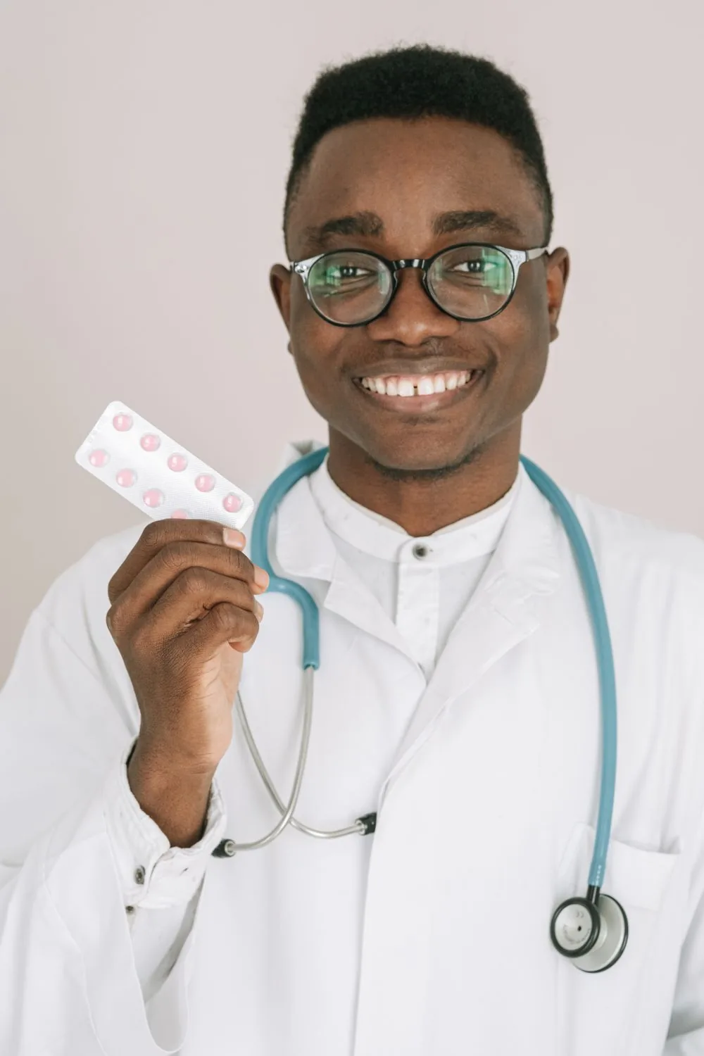 Friendly pharmacist handling a prescription transfer